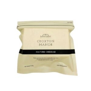 buy croxton manor mature cheddar 400g uae - premium british aged cheese block on wooden board with grapes and crackers for gourmet cheese platter