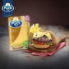 Bulk packaging of Puck Mozzarella Natural Cheese Slices for wholesale buyers.